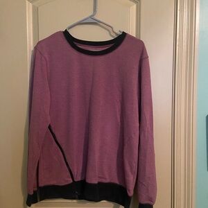 Maroon sweater with side zipper.